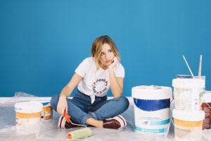 girl sitting paint materials